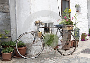 Decorative old bicycle and Trulli building of Alberobello, a UNESCO World Heritage Site