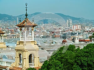 Decorative old building on the background of the panorama of Barcelona in Spain. City view from Plaza de Espana, beautiful photo