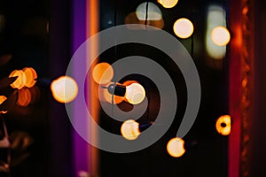 Decorative outdoor lights hanging in the garden at night