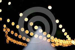 Decorative outdoor string lights at night time, Defocused Background, night city life backdrop, party time with Yellow