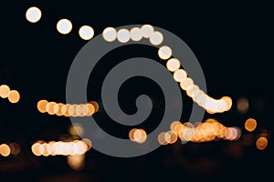 Decorative outdoor string lights at night time, Defocused Background, night city life backdrop, party time with Yellow