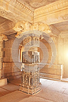 Decorative pillars from black basalt in mandappa or Hall. Hazara Rama Temple Hampi, Karnataka. Stone carving ancient. Indian God