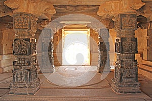 Decorative pillars from black basalt in mandappa or Hall. Hazara Rama Temple Hampi, Karnataka. Stone carving ancient. Indian God