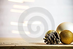 Decorative pine cones with gold christmas balls decoration Christmas background texture