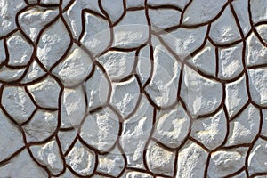 Decorative plaster imitating a decorative stone, decoration of the foundation and fence of a country house, texture