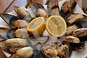 Decorative plate of delicious mussels with lemon