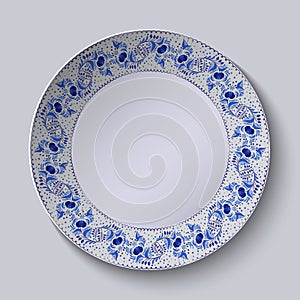 Decorative plate with floral pattern in blue and white space in the center. Stylized Gzhel.