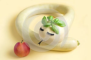 Decorative pumpkin in the form of a snake and an apple