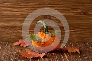 Decorative pumpkins and autumn leaves