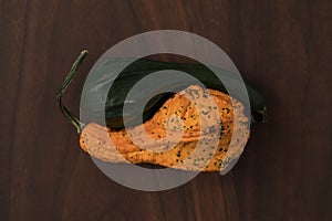 decorative pumpkins on walnut wood table