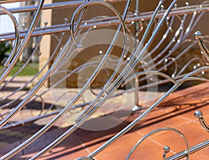 Decorative railing made of stainless metal close-up