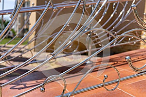 Decorative railing made of stainless metal close-up