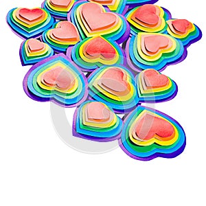 Decorative rainbow hearts border on pastel pink background  top view