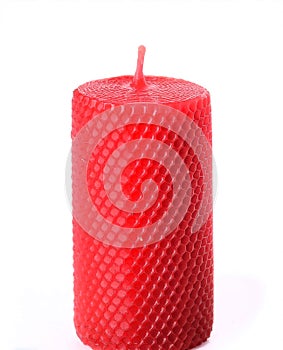 A decorative red candle, isolated on a white background.
