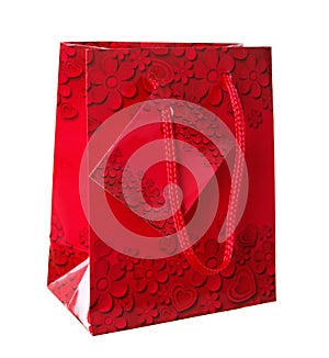 Decorative red gift bag with flower ornaments