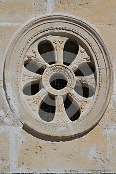 Decorative round window close-up in the ancient church, Montenegro