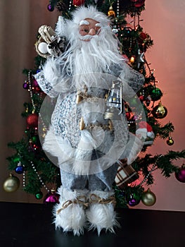 Decorative Santa Claus with a christmas tree