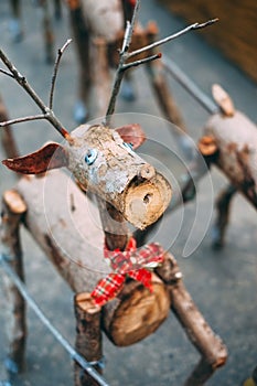 Decorative Santa reindeer made of wood logs and branches. Christmas concept