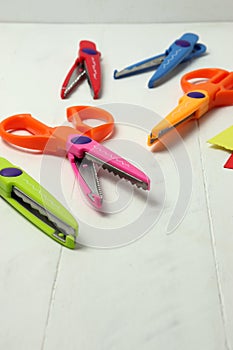 Decorative scissors on white surface