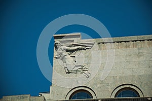 Decorative sculpture in Deco style on top of of building in Madrid