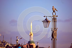 The decorative sculpture is a lantern on Ioanovsky Bridge on a hare island where the Peter and Paul Fortress is located. Historica