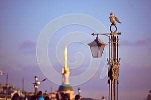 The decorative sculpture is a lantern on Ioanovsky Bridge on a hare island where the Peter and Paul Fortress is located. Historica photo