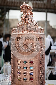 A decorative, Sephardic style Torah in a copper case with 12 jewels of the breast plate worn by the high Jewish priest.