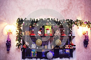 Decorative shelf with Christmas decorations on the wall in the living room