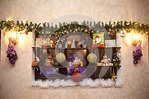 Decorative shelf with Christmas decorations on the wall in the living room
