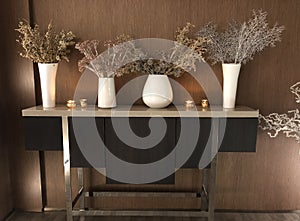 Decorative shelf on wooden background. White vases with dried plants and flowers