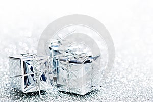 Decorative silver boxes with holiday gifts