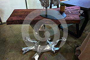 Decorative silver metal coffee table leg in the shape of a tree root