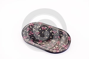 Decorative stand made of epoxy resin. Flower patterns. On a white background.