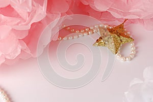 Decorative star, pearl beads and pink and white pom pom