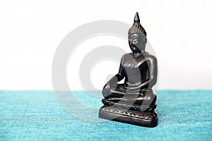 A decorative statue of Buddha, Buddha on the background of incense, Siddhartha Gautama has reached enlightenment. Symbol