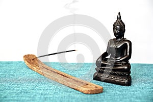 A decorative statue of Buddha, Buddha on the background of incense, Siddhartha Gautama has reached enlightenment. Symbol