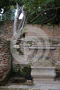 Decorative stone fountain, Alhambra gardens, Granada, Spain