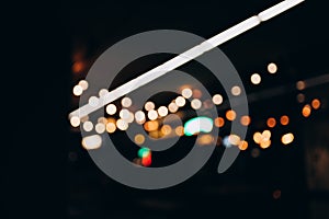 Decorative string lights at night time, Defocused Background, night city life backdrop, party time with Yellow bokeh