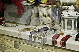 Decorative table setup featuring ribbons and beads arranged meticulously. combination of shiny metallics and vibrant