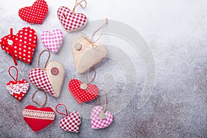 Decorative textile hearts on stone background. The concept of Valentine Day. Copy space for your text