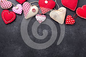 Decorative textile hearts on stone background. The concept of Valentine Day. Copy space for your text