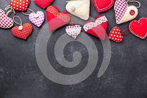 Decorative textile hearts on stone background. The concept of Valentine Day. Copy space for your text