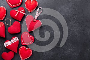 Decorative textile red hearts on stone background. The concept of Valentine Day. Copy space for your text