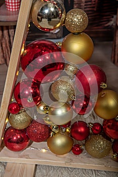 Decorative triangular Christmas tree of boards with balls. Christmas festive decorations