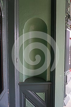 Decorative wall niche at vintage home front door
