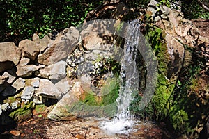 Decorative waterfall with a small pond