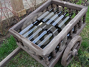 Decorative wheelbarrow with wine bottles