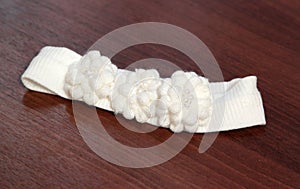 Decorative white knitted baby frontlet
