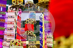 Decorative wicker lantern and Lanna fabric long flags hang on hotel lobby ceiling