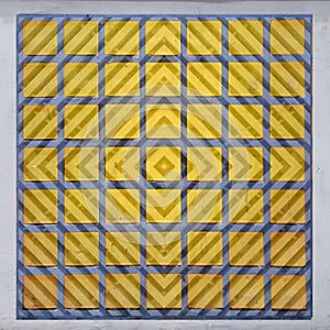 Decorative window panel, yellow glass with blue trellis cover